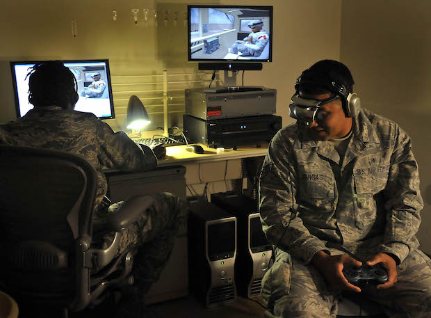 Senior Airman Joseph Vargas, a pharmacy technician with the 779th Medical Support Squadron, uses the Virtual Iraq program at Malcolm Grow Medical Center's Virtually Better training site on Andrews Air Force Base, Md. on June 25, 2009. The 79th Medical Wing is one of eight wings to use this new technology to treat patients suffering from post traumatic stress disorder. (U.S. Air Force photo by Senior Airman Renae Kleckner)(released)